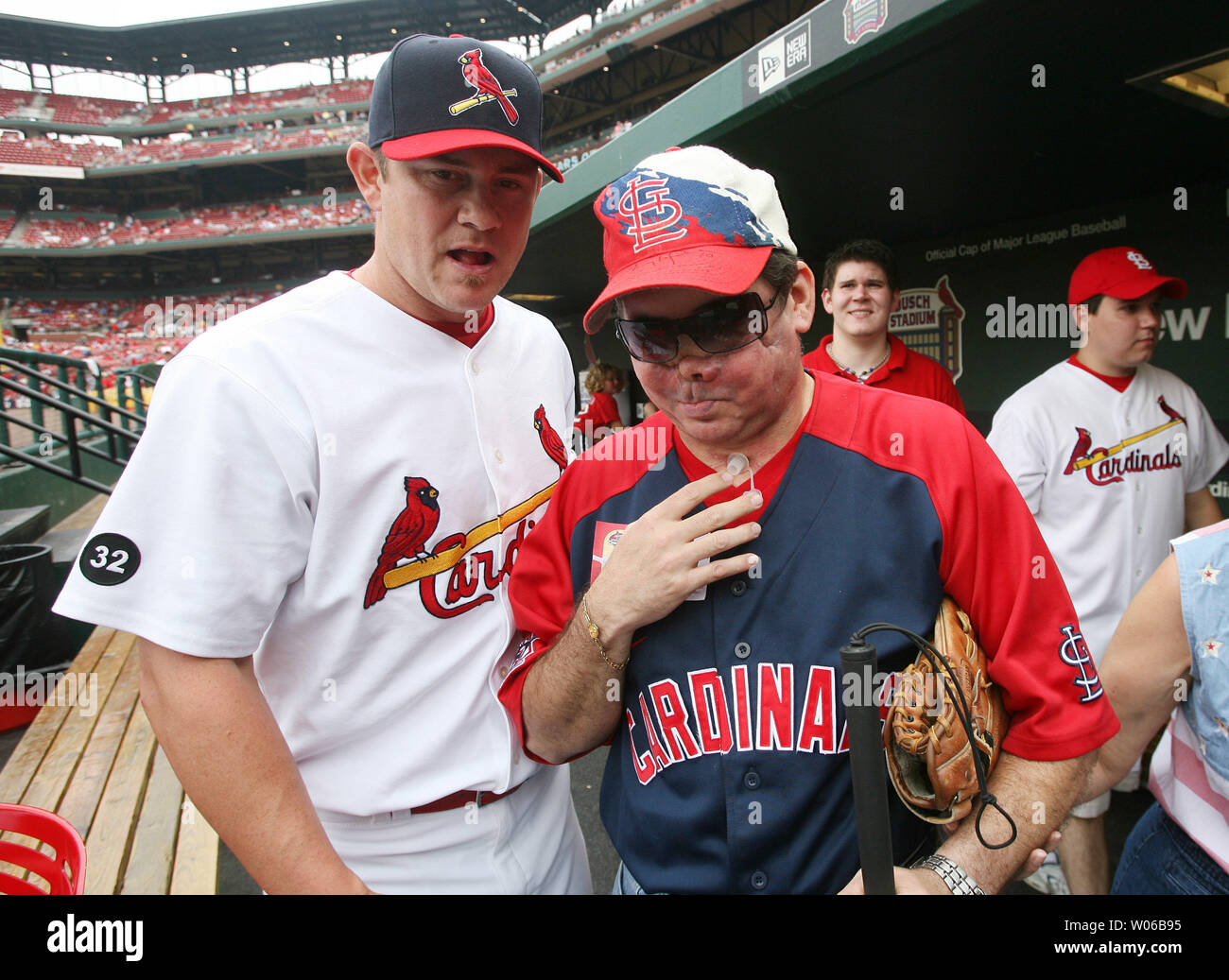 Belleville, Illinois Police Sgt. Jon Brough is helped to the field by
