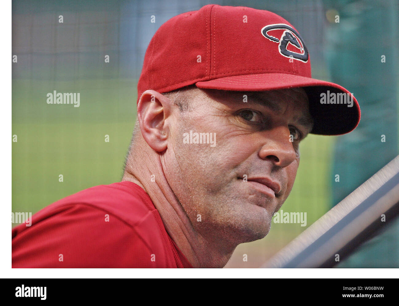 Arizona Diamondbacks coach Kirk Gibson looks around the dugout during a