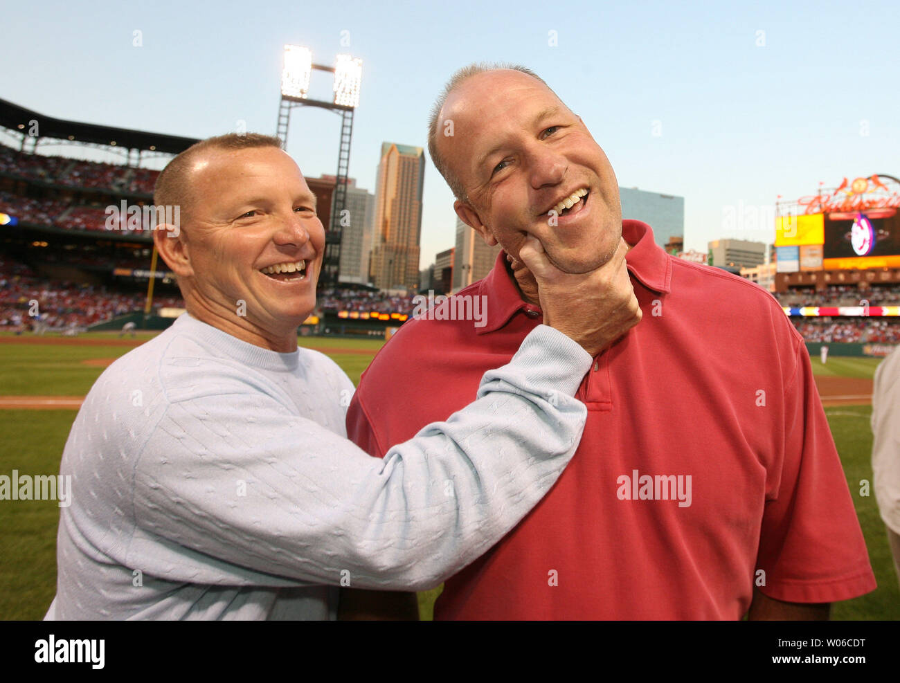 Former St. Louis Cardinals pitchers Pat Perry (L) and Todd Worrell clown  around as the 1987 World Series Cardinals gather for a reunion at Busch  Stadium before the current Cardinals take on
