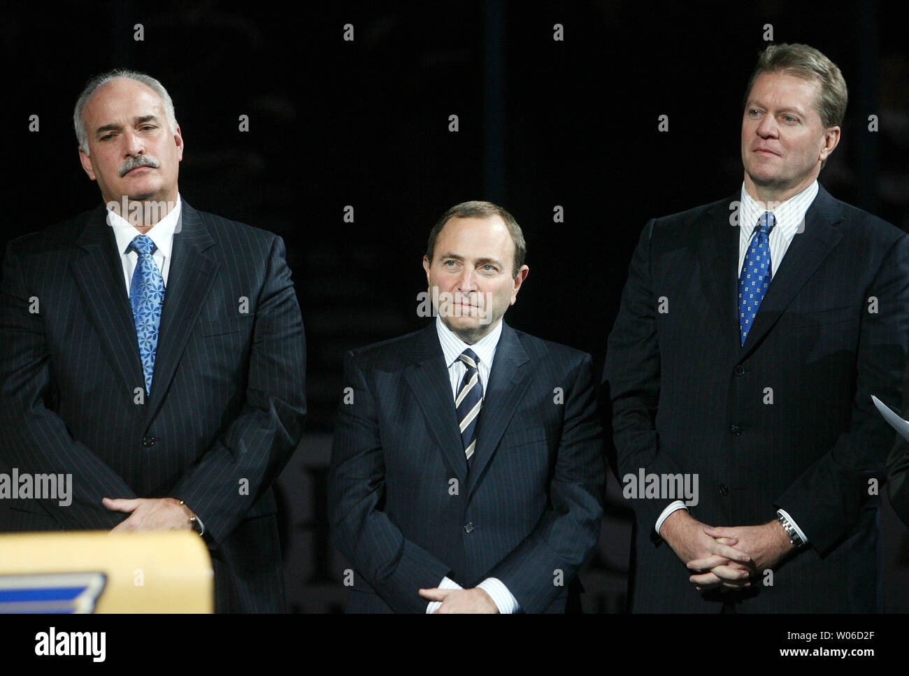 St. Louis Blues president John Davidson (L) NHL Commissioner Gary Bettman  (C) and team owner Dave Checketts, listen as former St. Louis Blues  defenseman and hockey's newest member of the Hockey Hall