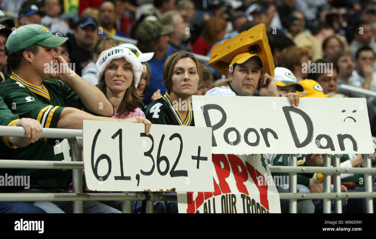 Green Bay Packers fans hold signs in anticipation of their quarterback Brett Favre, breaking Dan Marino's passing record as the Packers play the St. Louis Rams at the Edward Jones Dome in St. Louis on December 16, 2007. Favre threw for 201 yards and two touchdowns, eclipsing Dan Marino to become the NFL career leader in yards passing. (UPI Photo/Bill Greenblatt) Stock Photo