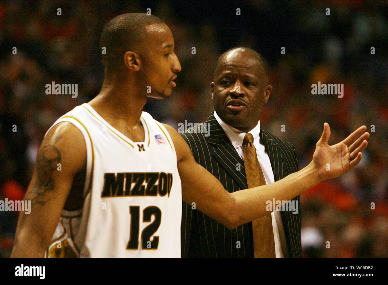 University of Missouri's Jason Horton (L) talks things over with head basketball  coach Mike Anderson in the first half of the Annual Busch Braggin' Rights  game against the University of Illinois at