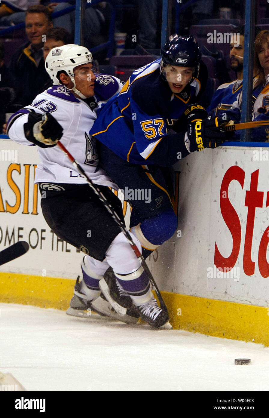 Los Angeles Kings Michael Cammalleri (L) forces St. Louis Blues David Perron into the boards during the first period at the Scottrade Center in St. Louis on March 4, 2008.  (UPI Photo/Bill Greenblatt) Stock Photo