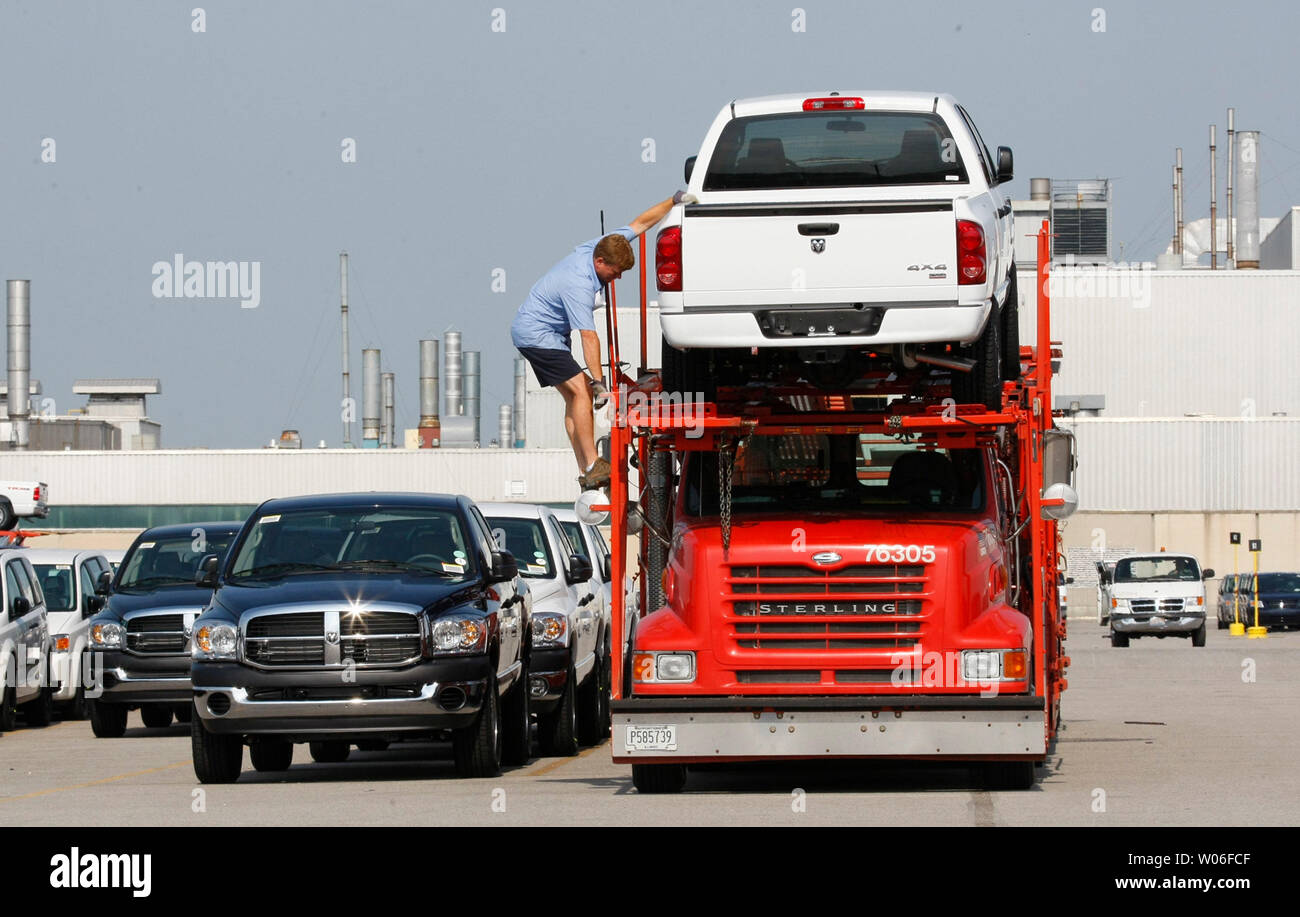 Dodge Ram trucks are loaded onto a carrier at the Daimler Chrysler Assembly  plant north and south in Fenton, Missouri on July 2, 2008. Daimler Chrysler  has announced that they will stop