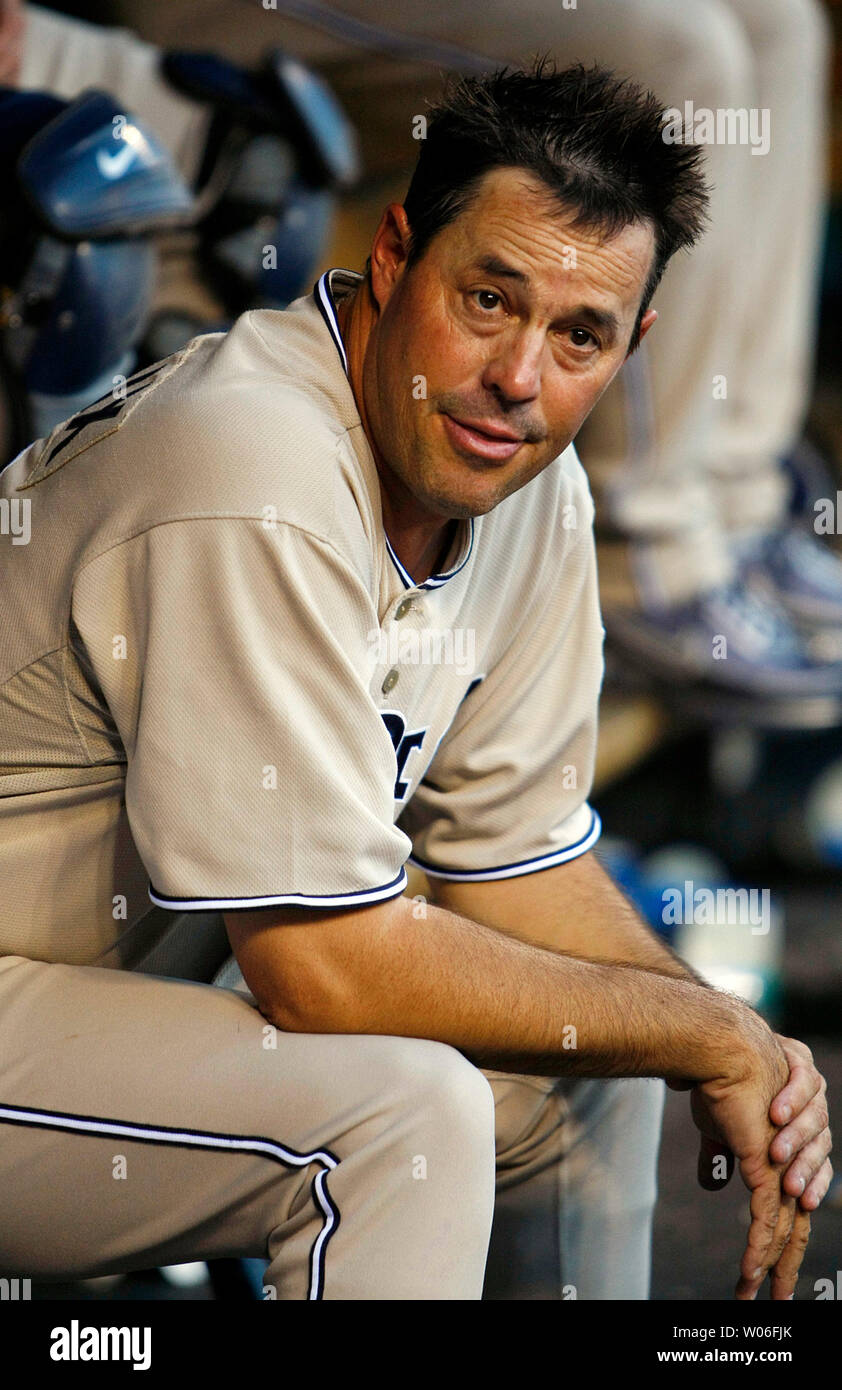 San Diego Padres starting pitcher Greg Maddux takes a breather in the dugout during a game