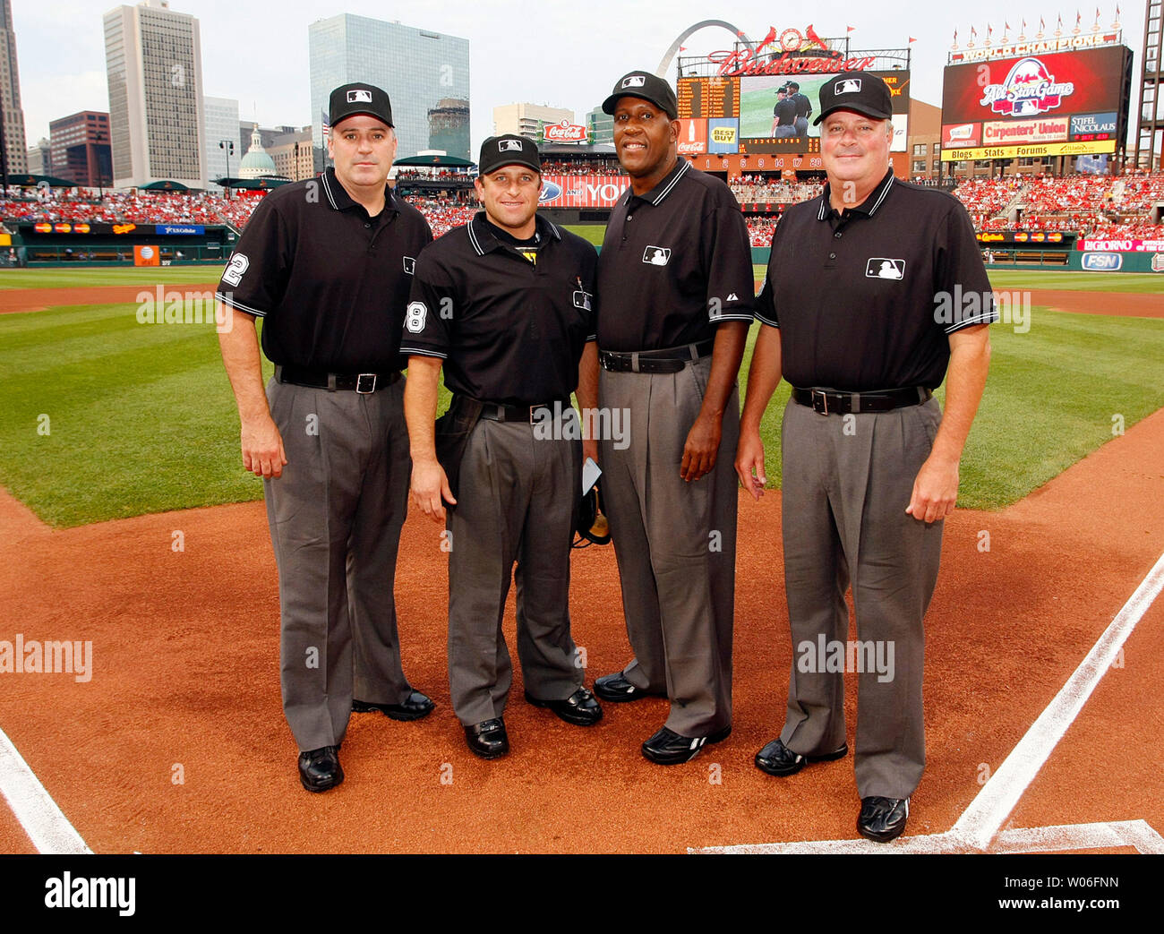 Major League umpires (L to R) Bill Welke, Chris Guccione, Chuck Meriwether and Tim Welke pose for a photograph before the Los Angeles Dodgers and the St. Louis Cardinals baseball game at Busch Stadium in St. Louis on August 6, 2008. (UPI Photo/Bill Greenblatt) Stock Photo