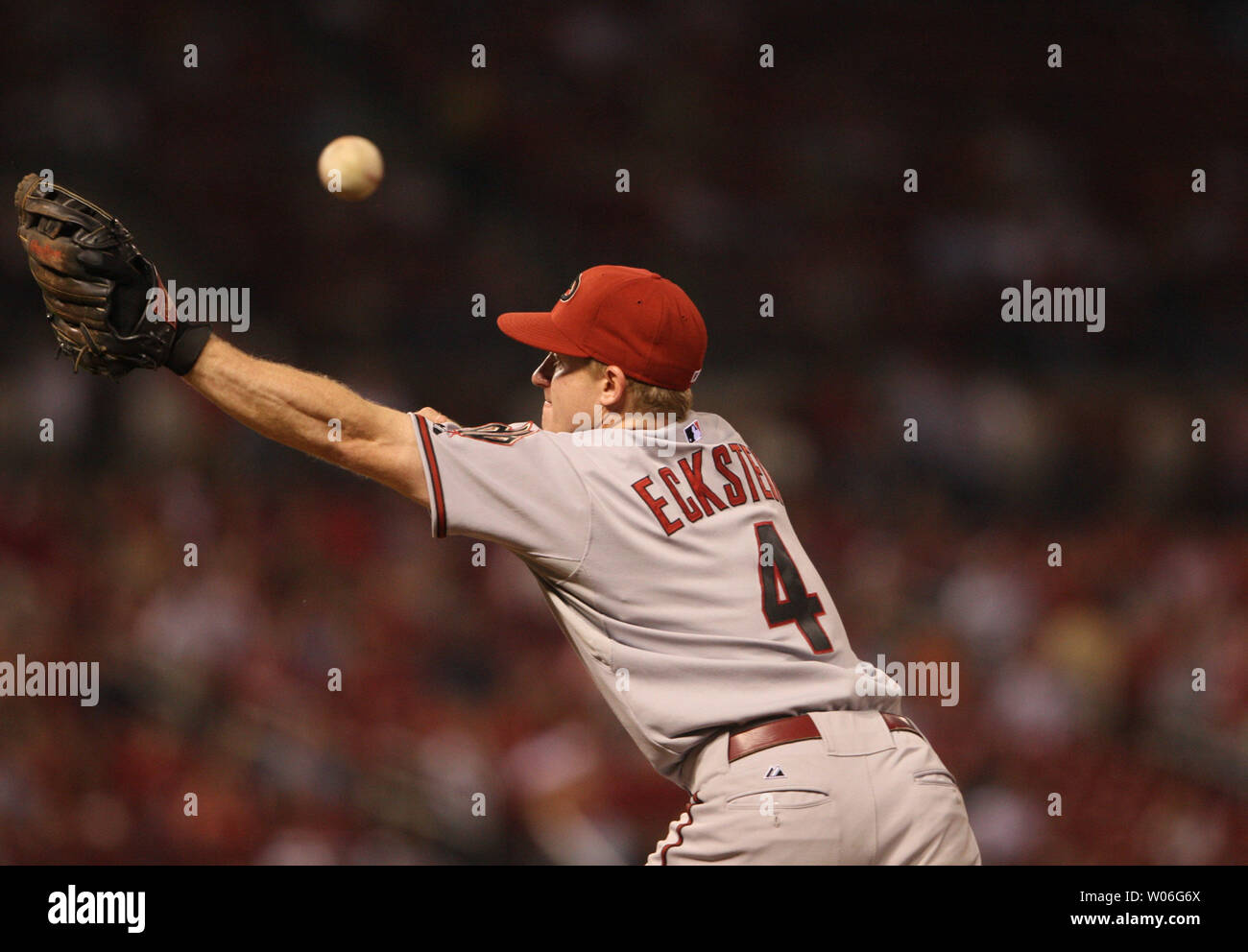 Arizona Diamondbacks Second Baseman David Eckstein Tries To Catch A Wide Throw From Pitcher Max Scherzer While Covering First Base In The Second Inning Against The St Louis Cardinals At Busch Stadium