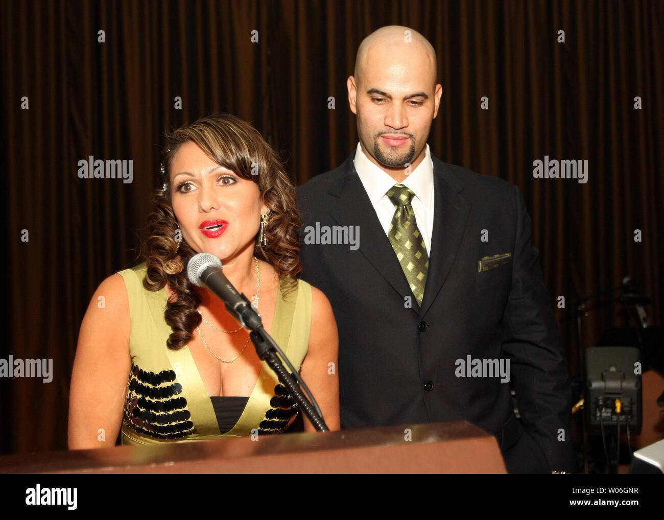 St. Louis Cardinals first baseman and the 2008 National League's Most  Valuable Player Albert Pujols listens as wife Deidre speaks to those  attending the Annual Pujols Family Foundation Holiday Party at the