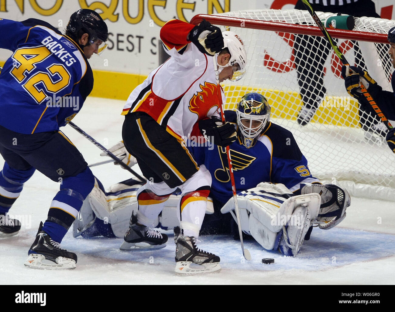 Calgary Flames Michael Cammalleri (13) tries to push the puck by St. Louis Blues goaltender Chris Mason while Blues David Backes (42) tries to clear the zone in the first period at the Scottrade Center in St. Louis on December 16, 2008. Calgary defeated St. Louis 6-3.  (UPI Photo/Bill Greenblatt) Stock Photo