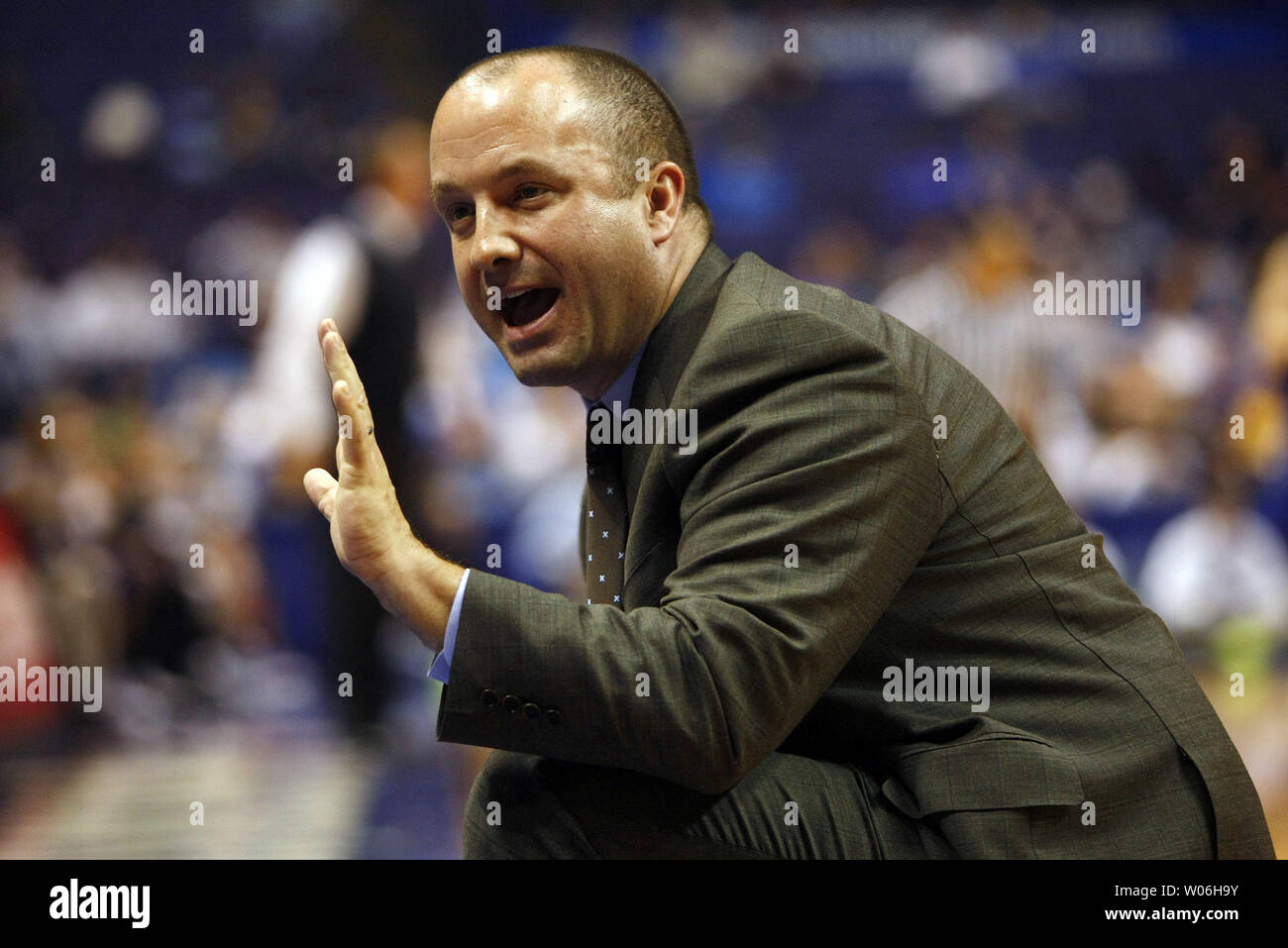 Drake Bulldogs head basketball coach Mark Phelps gives his team instructions during the first half of the opening round of the  Missouri Valley Tournament against the Indiana State Sycamores at the Scottrade Center in St. Louis on March 5, 2009.  (UPI Photo/Bill Greenblatt) Stock Photo
