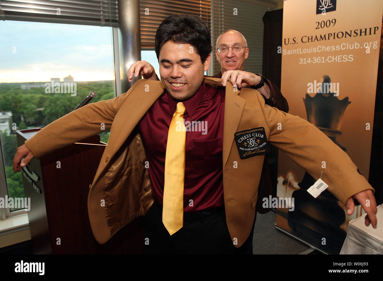 Rex Sinquefield founder of the The Chess Club and Scholastic Center of Saint Louis presents Hikaru Nakamura of White Plains, New York with the Brown Jacket after winning the U.S. Chess Championship in St. Louis on May 17, 2009. Nakamura beat out 25 others from across the United States to win the invitational tournament. (UPI Photo/Bill Greenblatt) Stock Photo