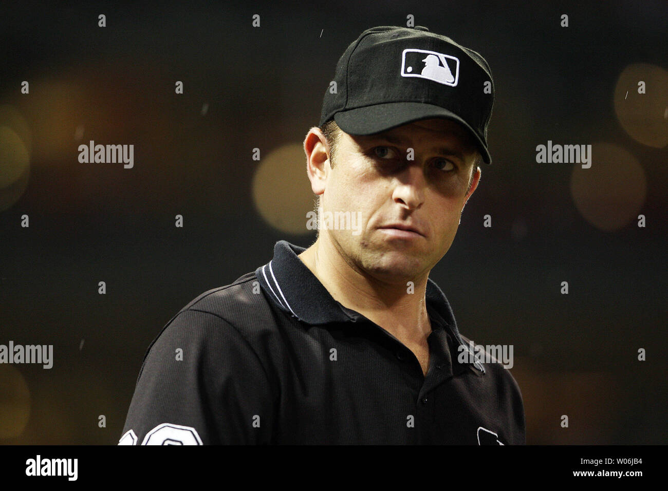 First base umpire Chris Guccione looks to the crowd in the ninth inning of a game between the Kansas City Royals and the St. Louis Cardinals at Busch Stadium in St. Louis on May 22, 2009. (UPI Photo/Bill Greenblatt) Stock Photo
