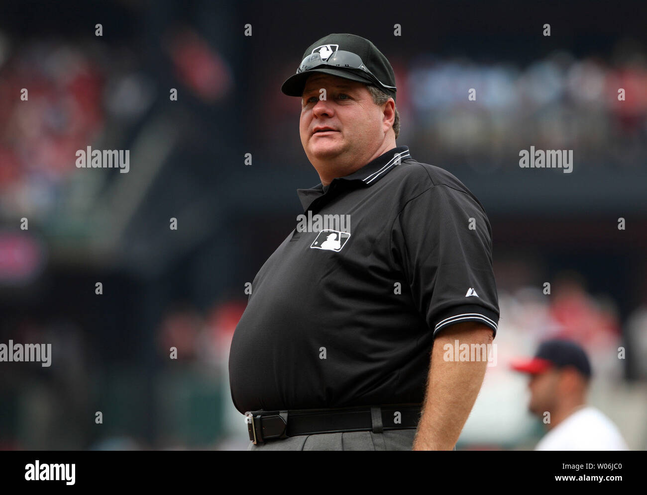 first-base-umpire-jerry-layne-talks-to-players-in-the-st-louis-cardinals-dugout-between-innings-during-a-game-with-the-lansas-city-royals-at-busch-stadium-in-st-louis-on-may