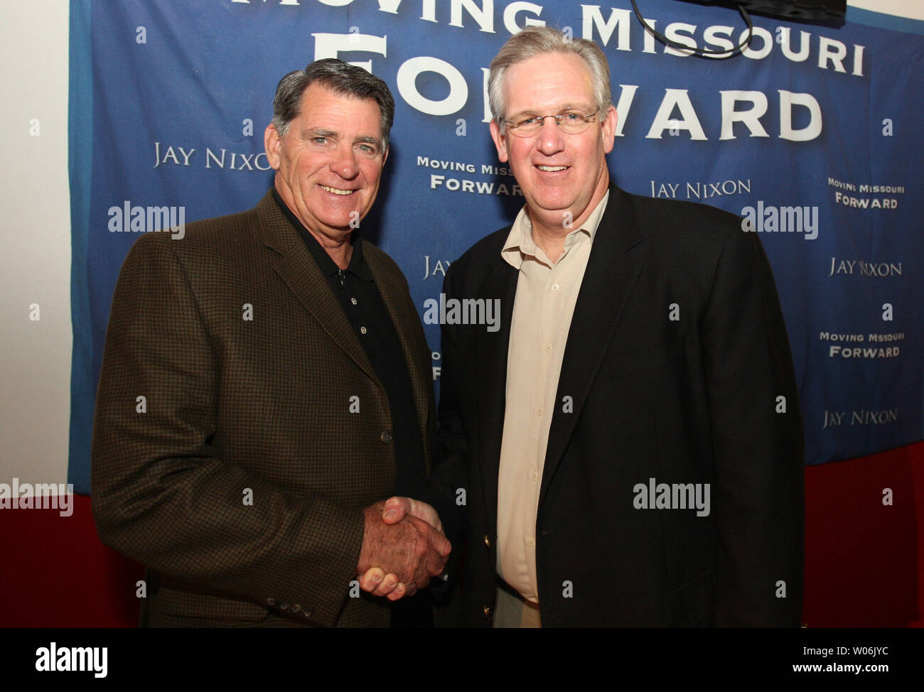 St. Louis Cardinals broadcaster Mike Shannon (L) greets Missouri Governor  Jay Nixon as Shannon celebrates his 75th birthday with family and friends  at Mike Shannon's Steak and Seafood in St. Louis on