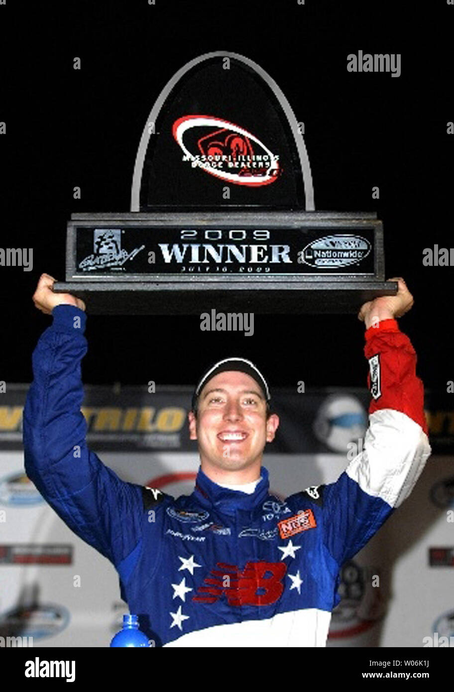 NASCAR driver Kyle Busch holds the first place trophy after winning the MissouriIllinois Dodge