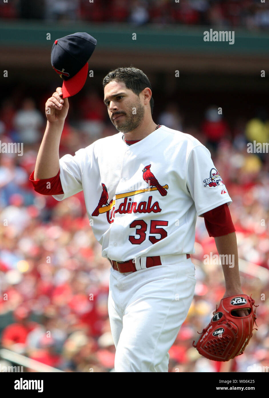 St. Louis Cardinals pitcher Chris Carpenter tips his cap to the cheering  crowd as he leaves the game against the Milwaukee Brewers in the seventh  inning at Busch Stadium in St. Louis