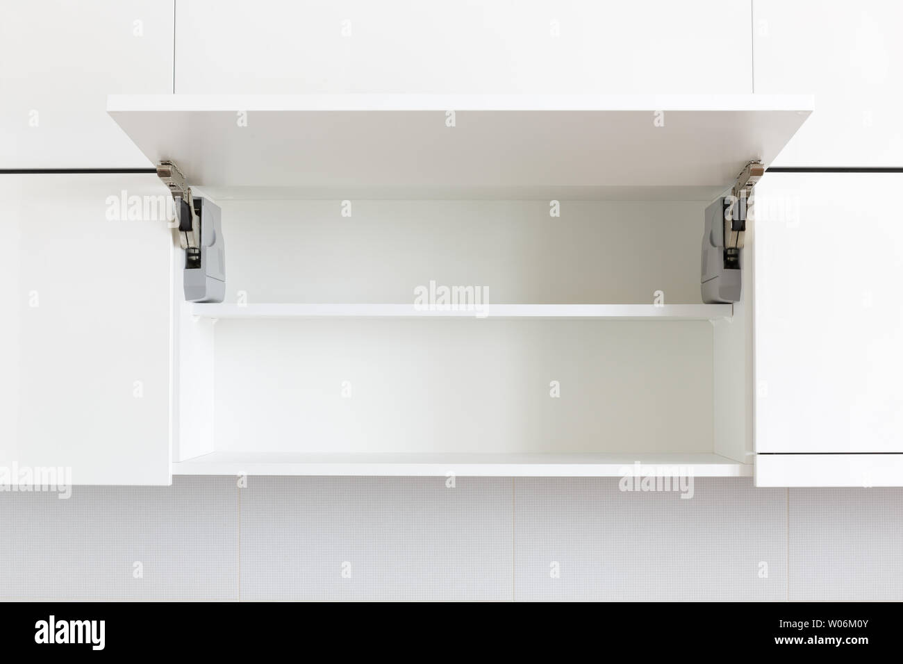 opened white kitchen cabinet with empty shelf Stock Photo - Alamy