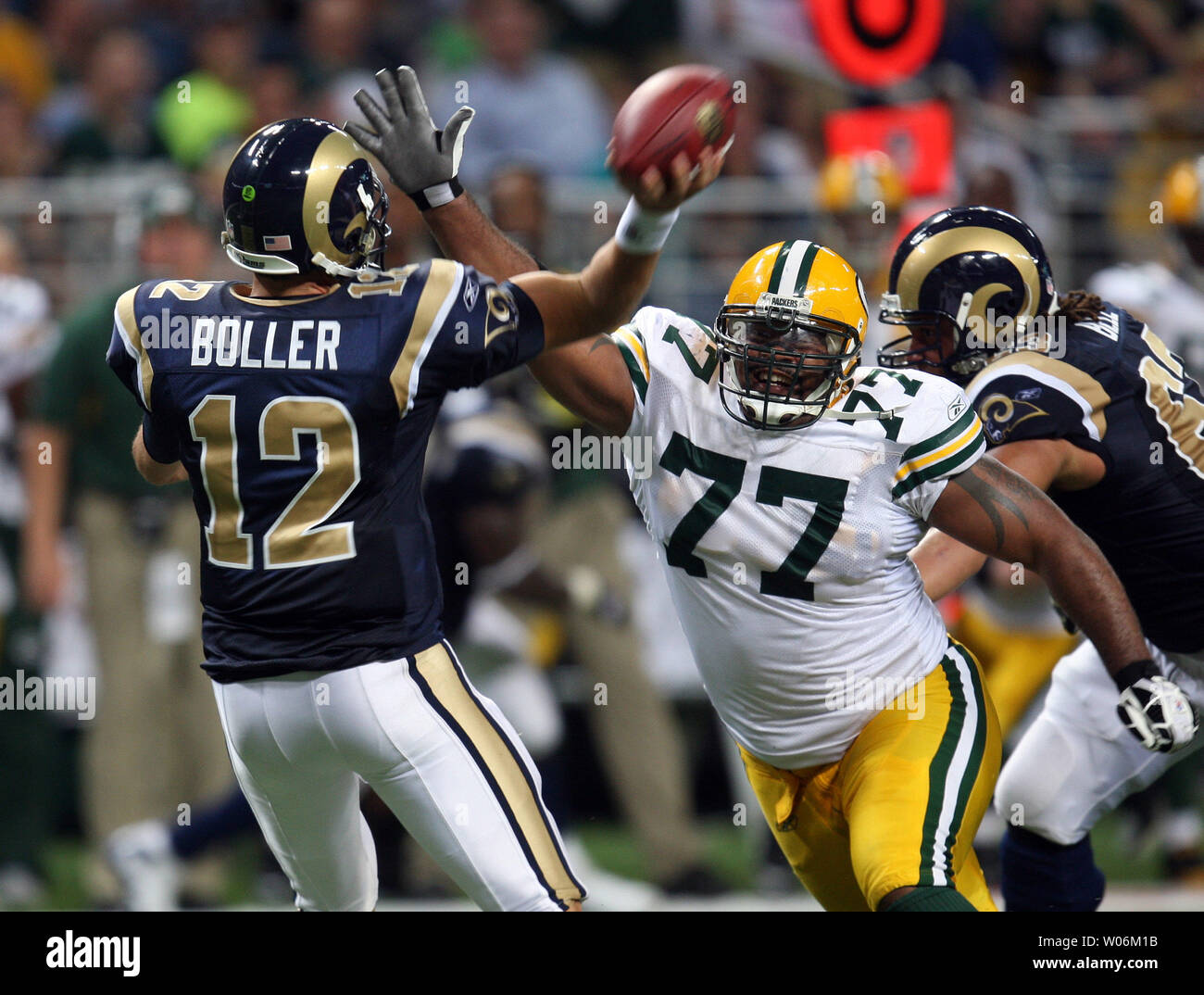 Green Bay Packers Cullen Jenkins (77) pressures St. Louis Rams quarterback Kyle Boller during the fourth quarter at the Edward Jones Dome in St. Louis on September 27, 2009. Green Bay won the game 36-17.   UPI/Bill Greenblatt Stock Photo
