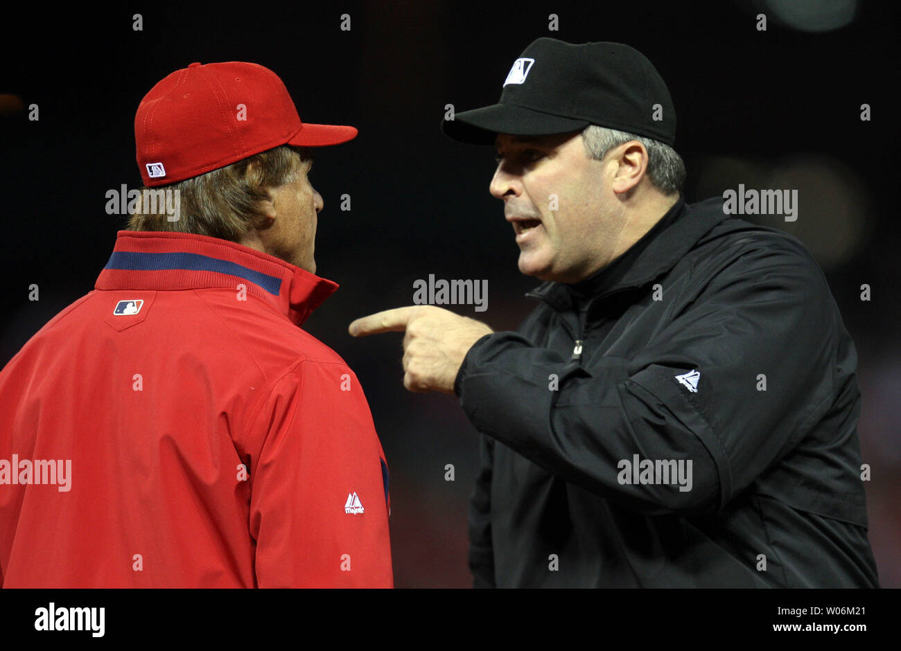 Umpires Laz Diaz and Mike Estabrook (L) comment to St. Louis Cardinals  manager Mike Matheny about the blue uniforms before a game against the  Milwaukee Brewers at Busch Stadium in St. Louis