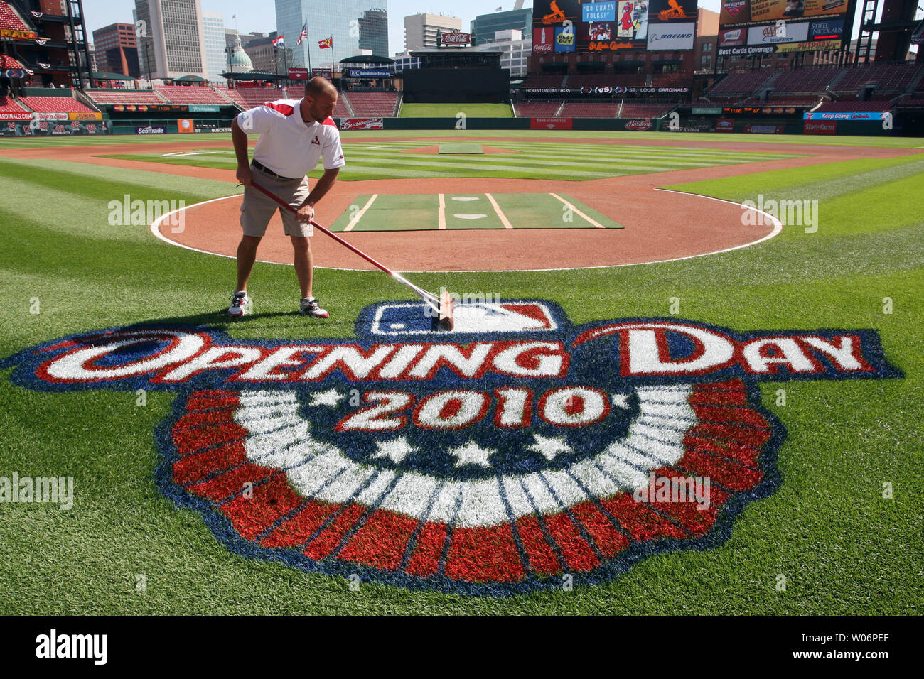 Busch Stadium head groundskeeper Billy Findlay brooms the infield at