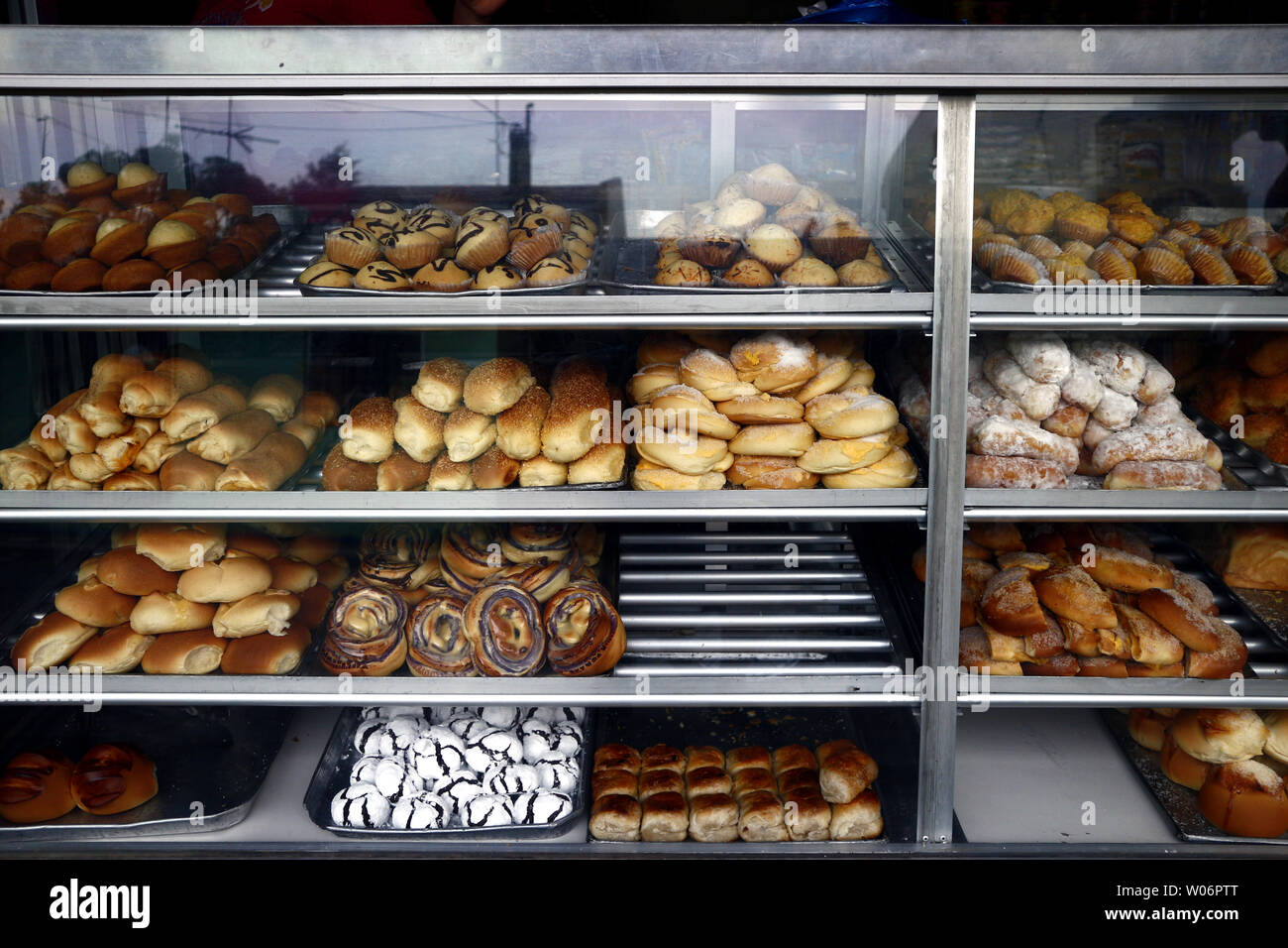 Photo of assorted freshly baked bread and pastry on display at a
