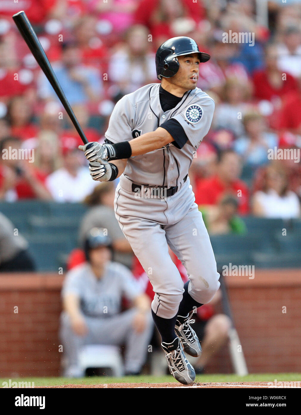 Seattle Mariners Ichiro Suzuki of Japan watches as the baseball leaves  Busch Stadium for a solo home run against the St. Louis Cardinals in the  first inning in St. Louis on June