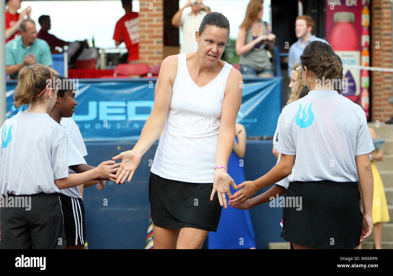 Three-time Grand Slam singles champion  and former world No.1 women's tennis player Lindsay Davenport slaps hands with young tennis players as she is introduced as a member of the St. Louis Aces during their match against the Sacramento Capitals in World Team Tennis matches at the Dwight Davis Tennis Center in St. Louis on July 7, 2010.  UPI/Bill Greenblatt Stock Photo