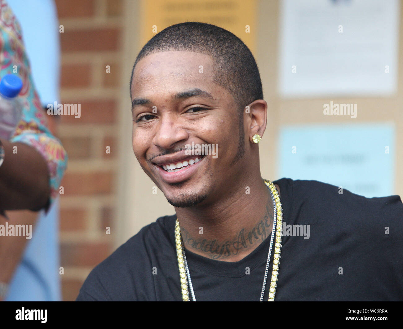 Rapper Chingie smiles for a photo as he watches Washington Kastles