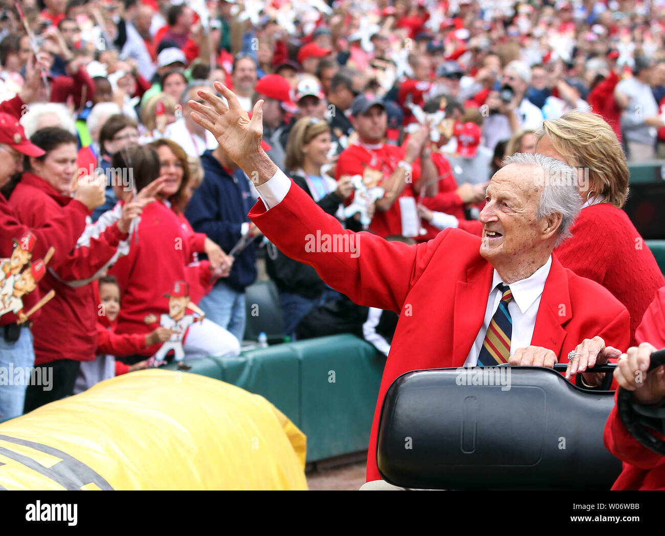 Former St. Louis Cardinals slugger and member of the National Baseball Hall of Fame Stan Musial, waves to fans during Stan Musial Day at Busch Stadium on October 2, 2010, in St. Louis. Word has come from the White House on November 17, 2010 that Musial will receive the Presidential Medal of Freedom in January 2011. Musial, who will be 90 later this week, is one of 14 awarded the Medal of Freedom today. Others include former President George H.W. Bush;  Maya Angelou, poet; Germany Chancellor Angela Merkel; U.S. Rep. John Lewis, D-Ga.; John H. Adams, co-founder of the Natural Resources Defense C Stock Photo