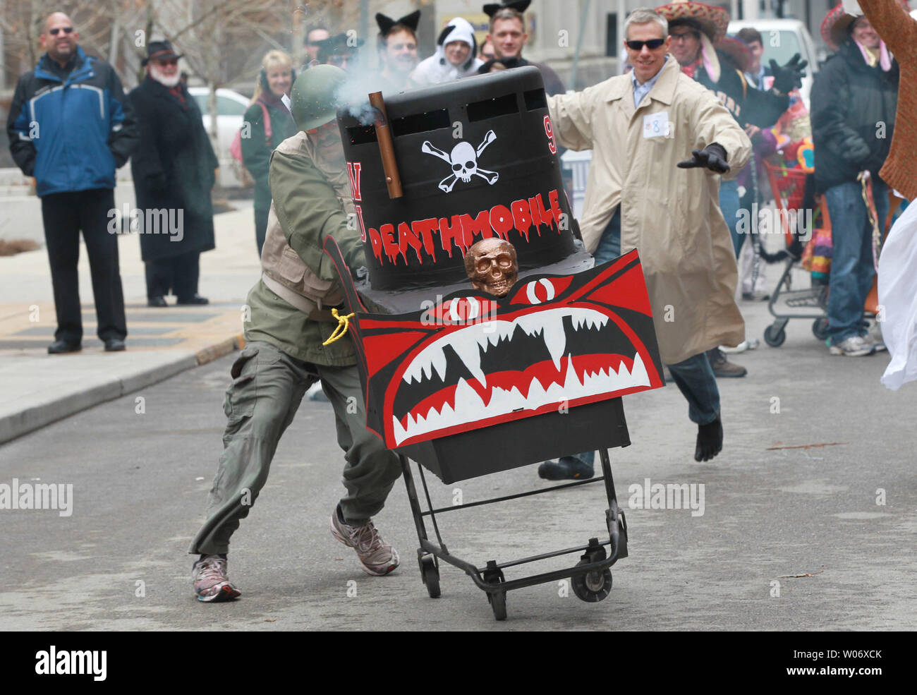 The Animal House crew runs their cart past judges before the start of