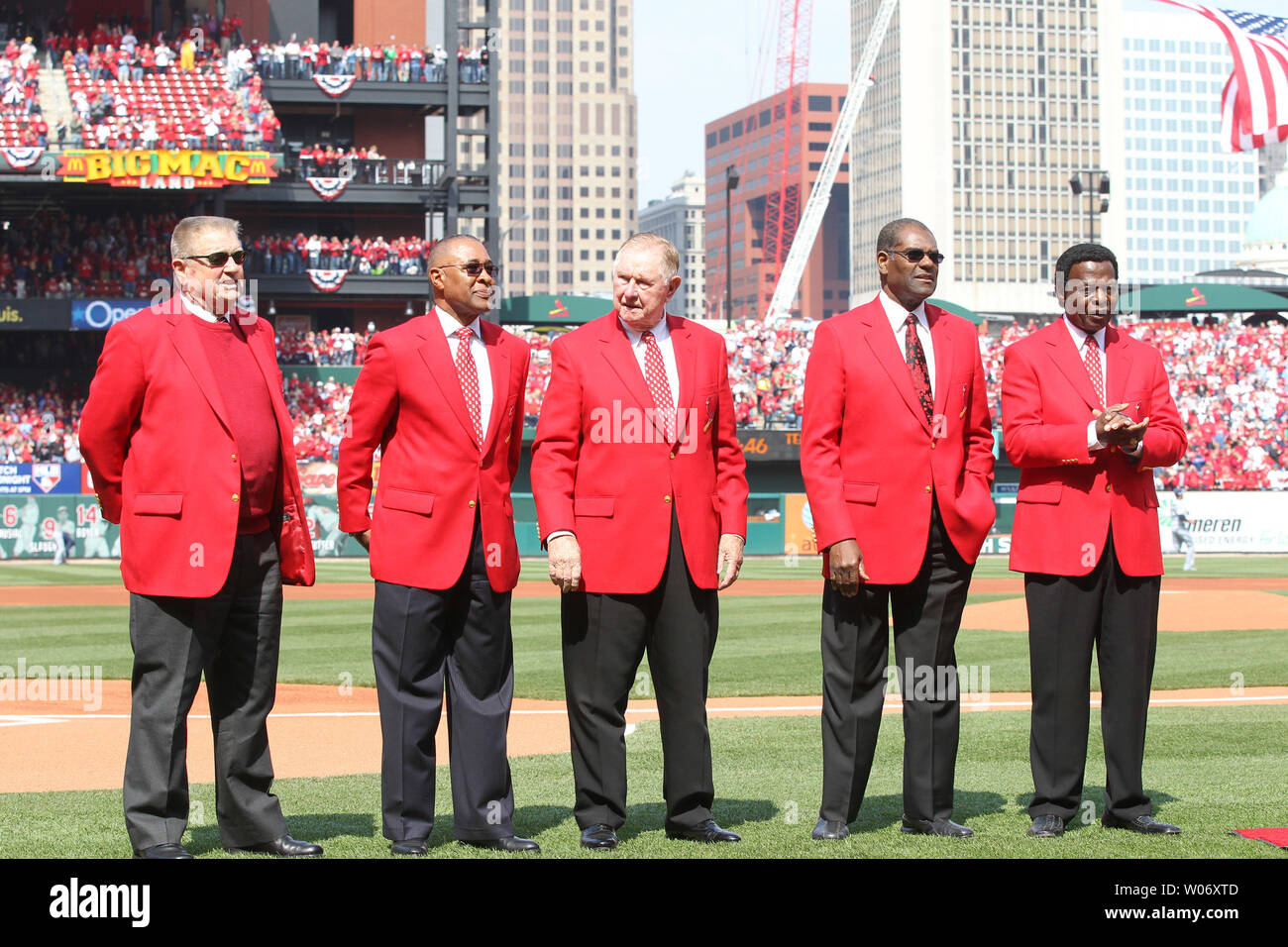 Former St. Louis Cardinals and National Baseball Hall of Fame members (L to  R) Whitey Herzog, Ozzie Smith, Red Schoendienst, Bob Gibson and Lou Brock  stand on the field at Busch Stadium
