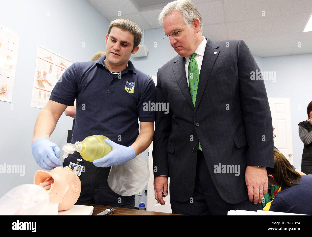 Missouri Governor Jay Nixon (R) looks on as paramedic student Mike Hollingsworth demonstrates how to intubate a patient at the Respond Right EMS Academy before talking with area business leaders during a roundtable discussion in St. Peters, Missouri on April 8, 2011. Nixon was on hand to discuss a new $27 million program designed to invest in small businesses across the state. The program, known as the State Small Business Credit Initiative, will begin accepting applications for loans from Missouri entrepreneurs today.  UPI/Bill Greenblatt Stock Photo