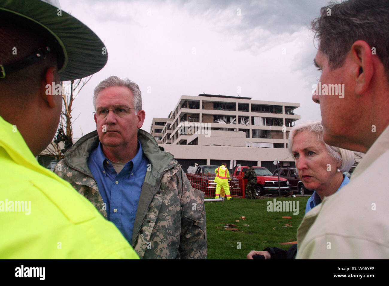 Missouri Governor Jay Nixon and First Lady Georganne Nixon talk with police outside Saint .John's Mercy Hospital in Joplin, Missouri on May 23, 2011. Officials say a EF-4 tornado cut a path a mile wide by four miles, destroying over 2000 homes and businesses on May 22, claiming 116 lives so far. UPI/Tom Uhlenbrock Stock Photo