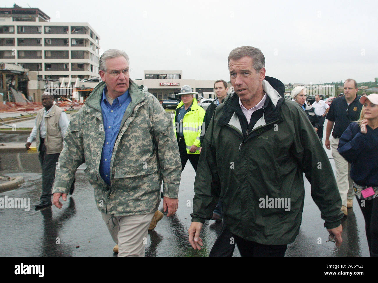 Missouri Governor Jay Nixon (L)  takes a walking tour of tornado damaged Jopin, Missouri with NBC's Brian Williams on May 22, 2011. Officials say the tornado cut a path a mile wide by four miles on May 22, destroying over 2000 homes and businesses, including the hospital and claiming 116 lives so far. Williams once lived in the southwestern Missouri town. UPI/Tom Uhlenbrock Stock Photo