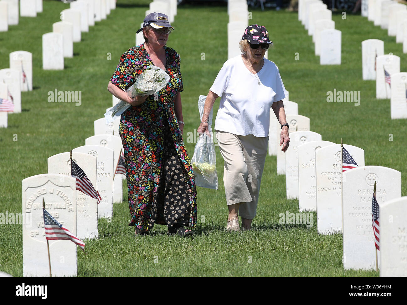 Visitors to Jefferson Barracks National Cemetery search for the