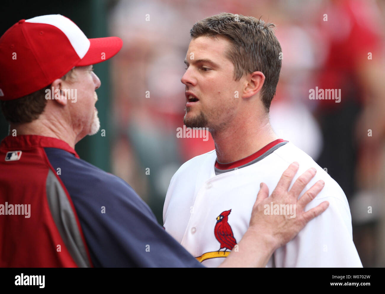 St. Louis Cardinals manager Mike Matheny and Mark McGwire watch