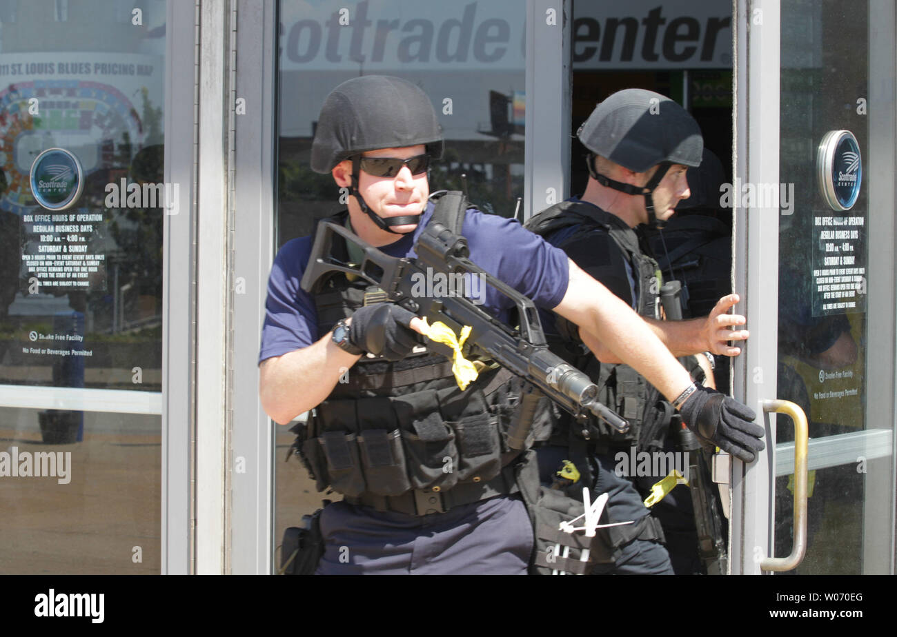 A member of the St. Louis Police Deprtment's SWAT team watches as the rest of his crew enters the building during a simulated disaster with a gunman at the Scottrade Center in St. Louis on August 7, 2011. The exercise gives the region's first responders the opportunity to test their ability to work together to manage a large emergency event.  UPI/Bill Greenblatt Stock Photo