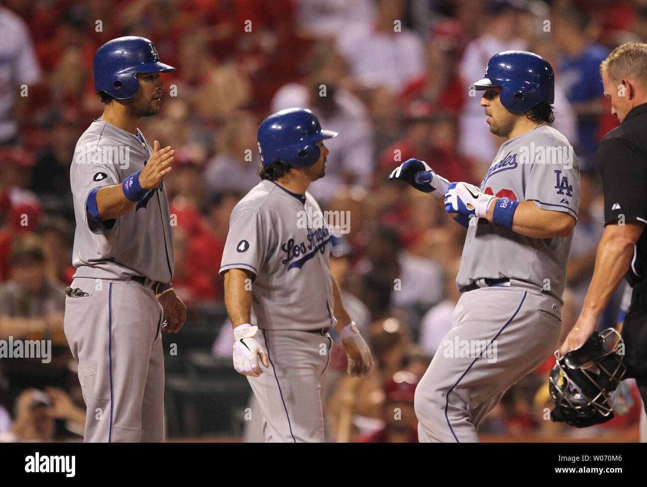 Los Angeles Dodgers Andre Ethier (L) and Aaron Miles (C) congratulate Rod Barajas after he hit a  three run home run in the fifth inning against the St. Louis Cardinals at Busch Stadium in St. Louis on August 23, 2011.  UPI/Bill Greenblatt Stock Photo