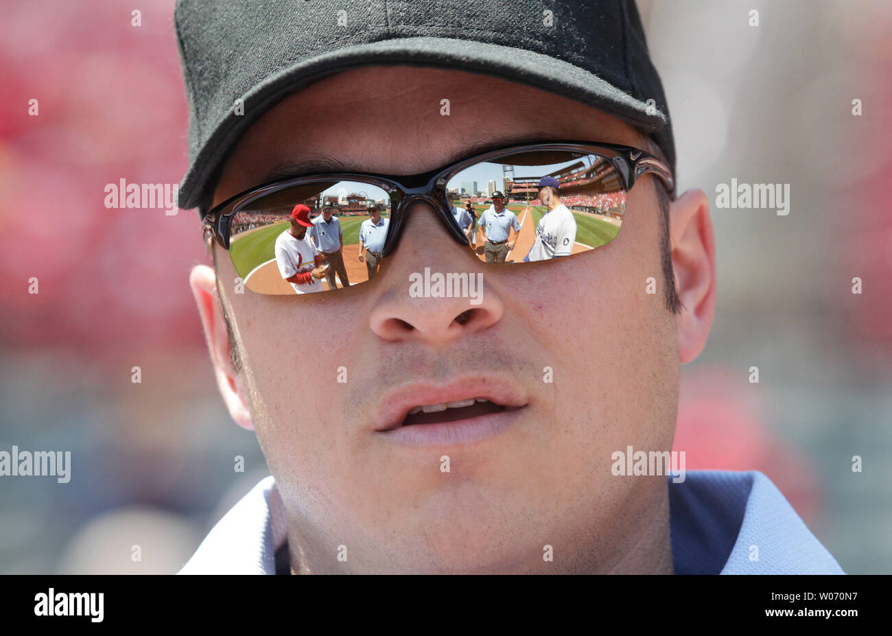 Homeplate umpire Mark Wegner waits for the lineup card exchange between