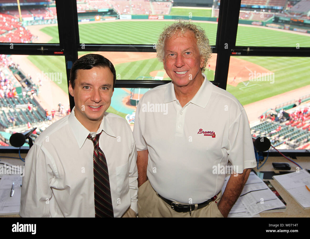 Atlanta Braves radio announcers Jim Powell (L) and National Baseball Hall of Fame member Don Sutton, pose for a photograph before a game between the Atlanta Braves and the St