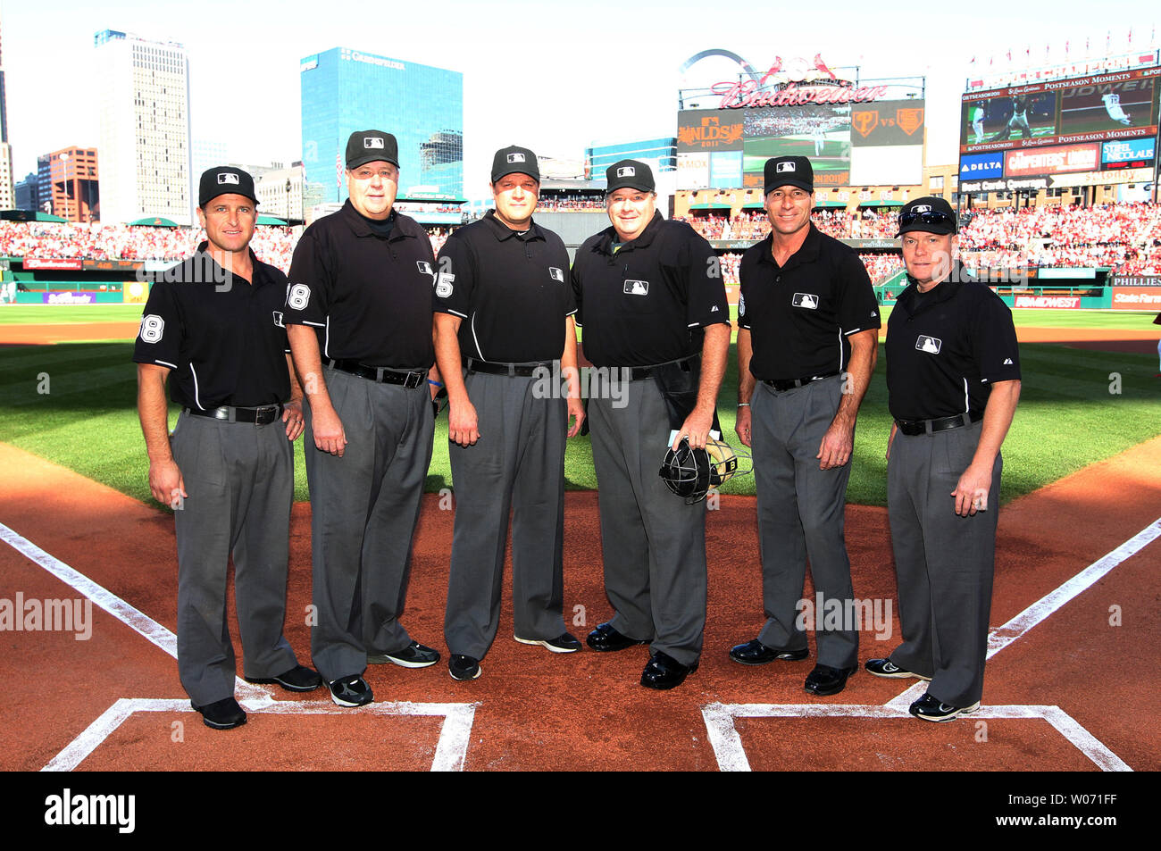 Umpires (L TO R)  Chris Guccione, Gary Cederstrom, Chad Fairchild, Jerry Layne, Angel Hernandez and Jerry Meals pose for a photograph before the start of Game 3 of the NLDS between the Philadelphia Phillies and the St. louis Cardinals at Busch Stadium in St. Louis on October 4, 2011.    UPI/Bill Greenblatt Stock Photo