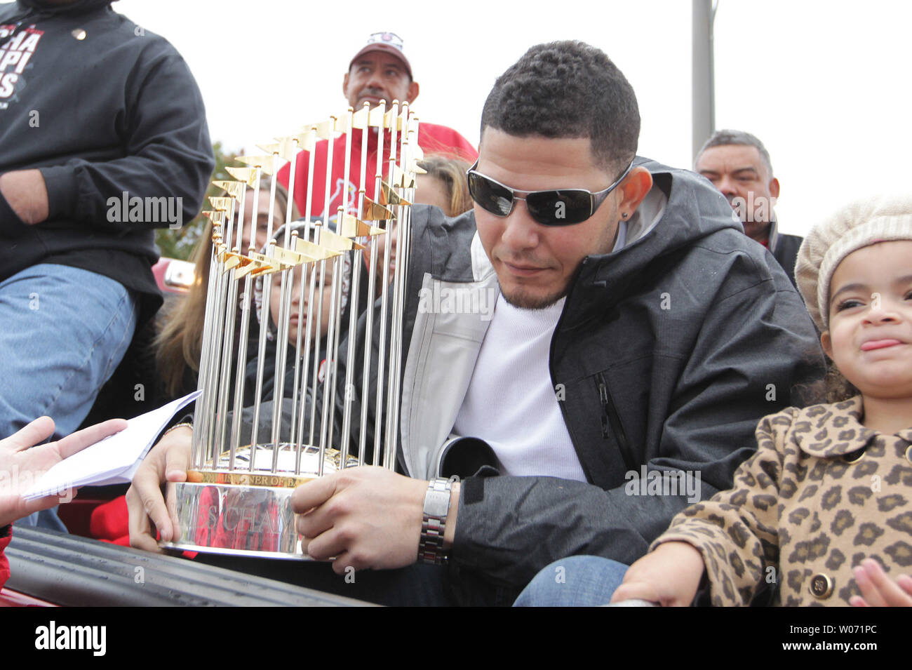 St. Louis Cardinals catcher Yadier Molina holds the World Series trophy  before a parade honoring the World Championship team that won the 2011 World  Series in St. Louis on October 30, 2011.