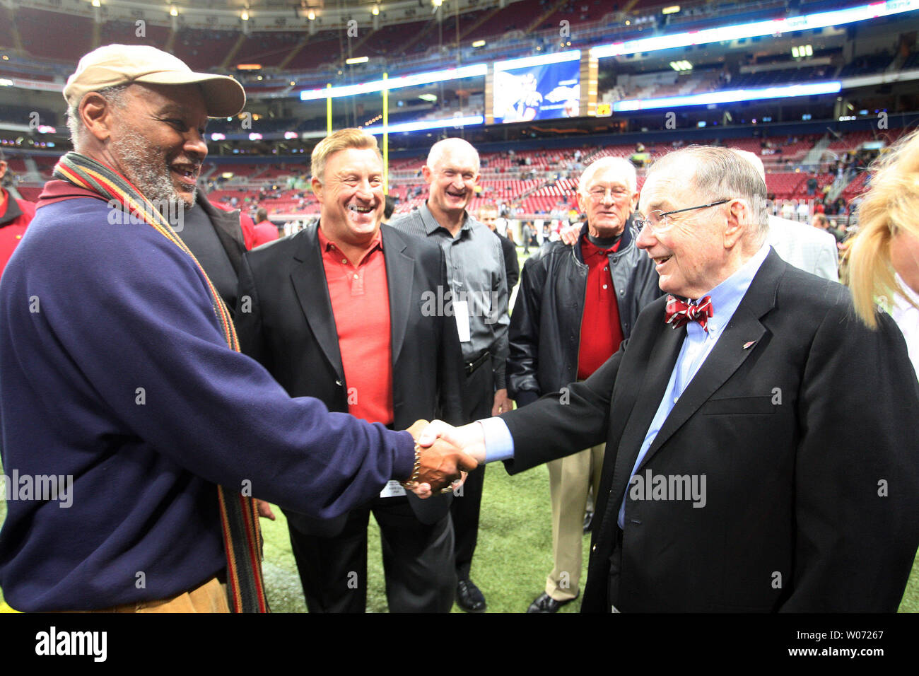 Members of the old St. Louis Football Cardinals ( L to R) Johnny Roland, Jim Otis, Mark Arneson and Larry Wilson say hello to their old boss Arizona Cardinals team owner Bill Bidwell before the Arizona-St. Louis football game at the Edward Jones Dome in St. Louis on November 27, 2011   UPI/Bill Greenblatt Stock Photo