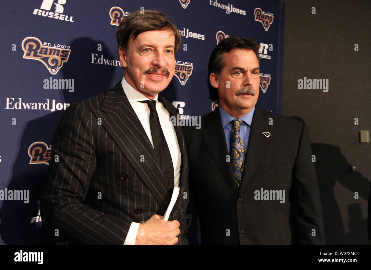 St. Louis Rams new head coach Jeff Fisher (R) poses for a photograph ...