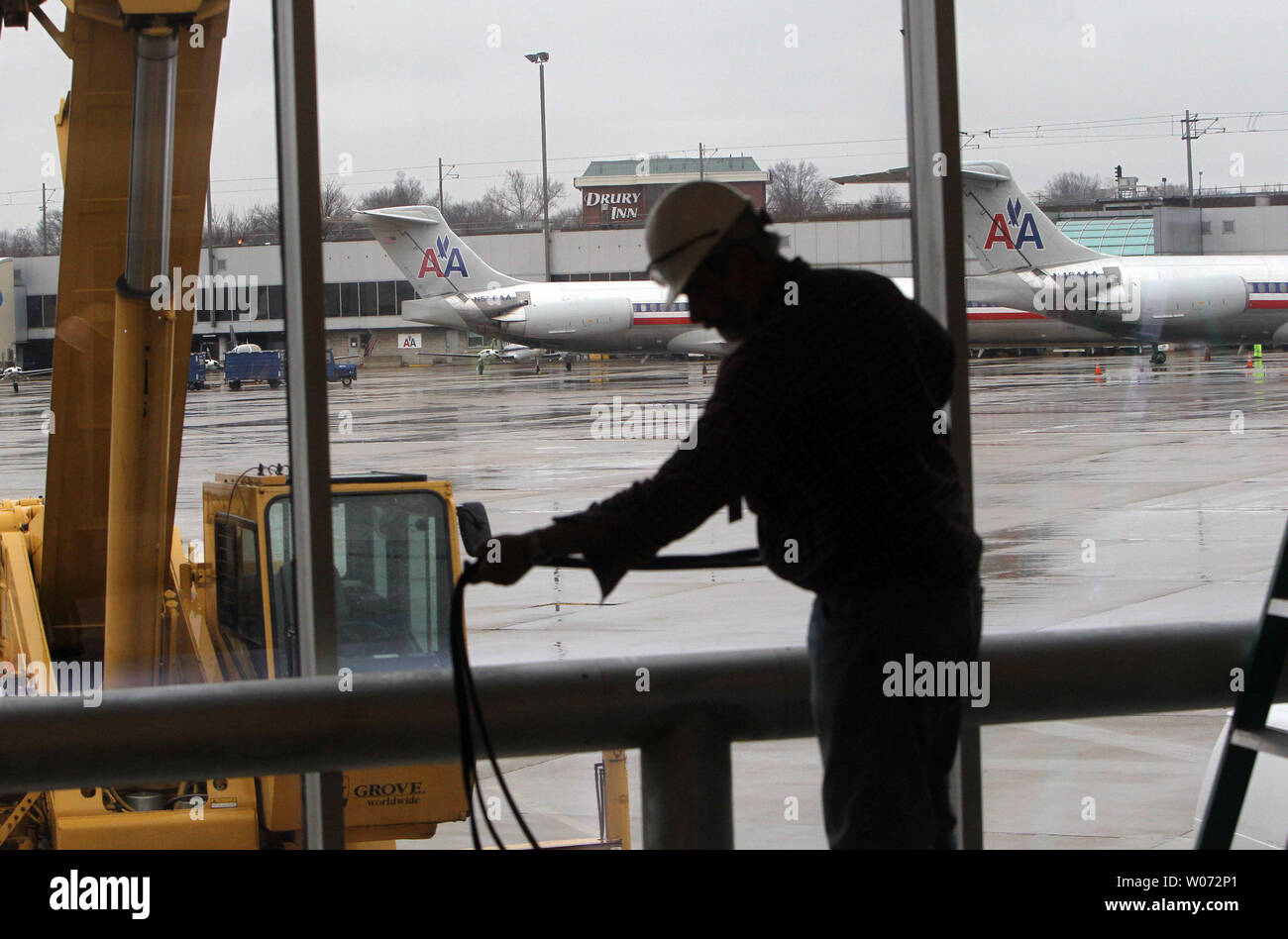 A construction worker installs wiring on the C Concourse at Lambert-St.  louis International Airport in St. Louis on January 26, 2012. The C  Concourse was heavily damaged during the April 22, 2011