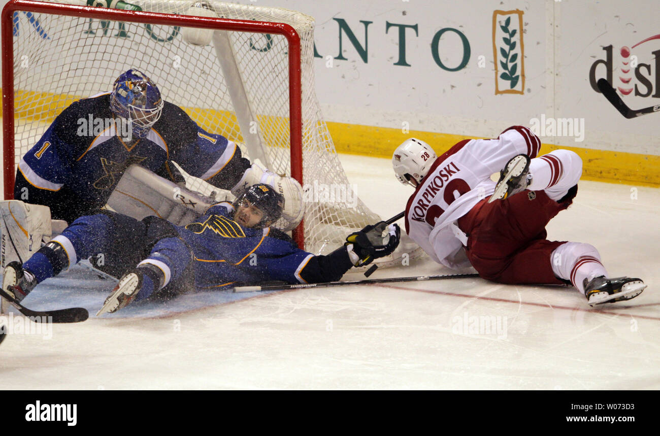 St. Louis Blues Carlo Colaiacovo (28) crashes into goaltender Brian Elliott as Phoenix Coyotes Lauri Korpikoskki of Finland falls in the third period at the Scottrade Center in St. Louis on April 6, 2012. Phoenix won the game 4-1.   UPI/Bill Greenblatt Stock Photo