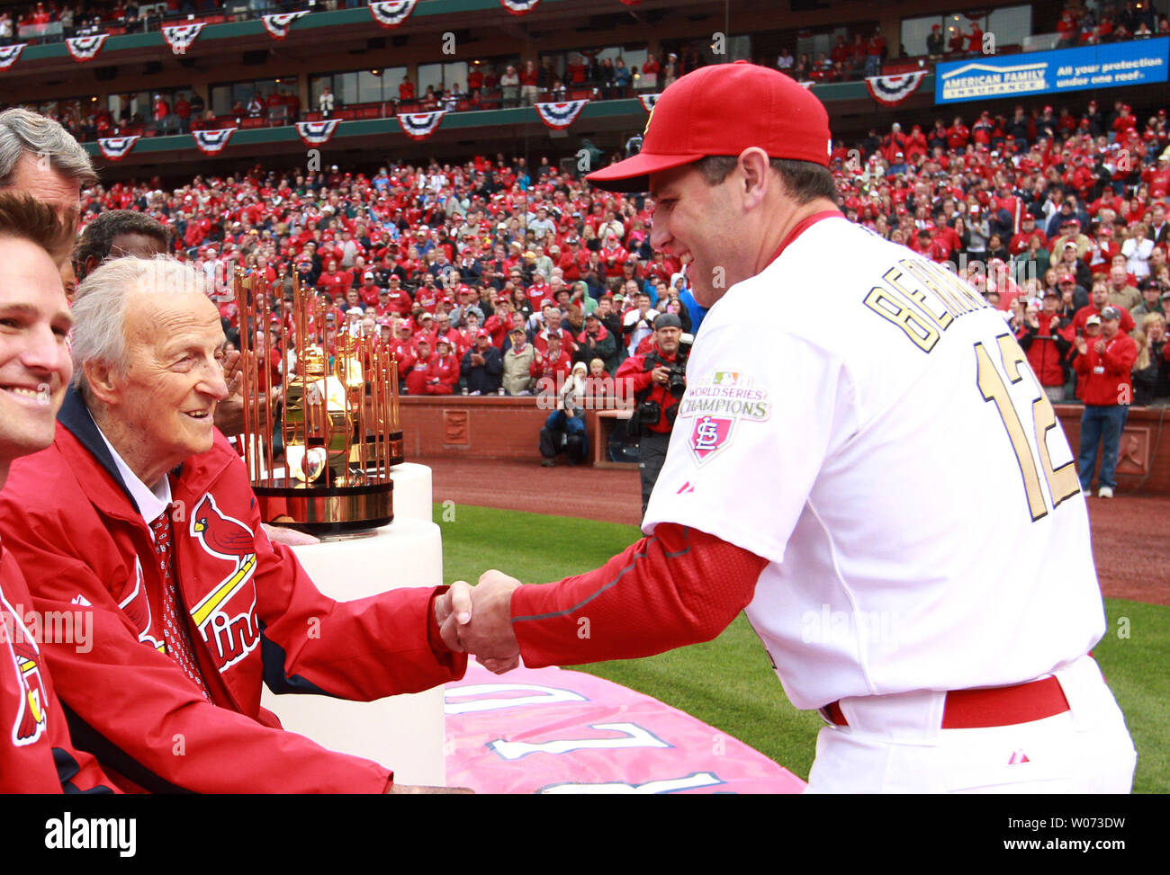 St. Louis Cardinals first baseman Lance Berkman shakes the hand of Hall of  Fame member Stan Musial during Opening Day ceremonies at Busch Stadium in  St. Louis oin April 13, 2012. UPI/Bill