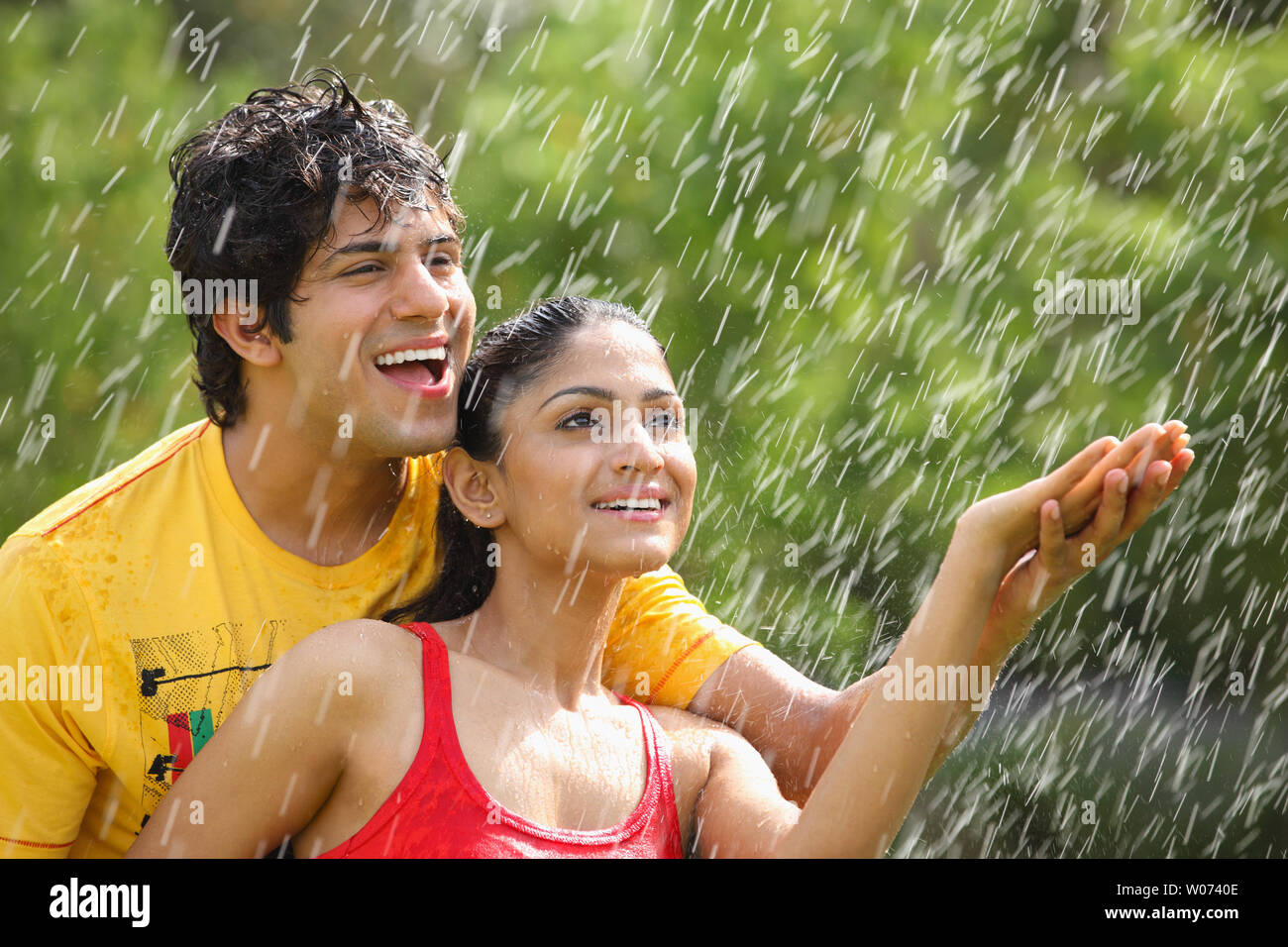 Indian Young couple enjoying rain Stock Photo - Alamy