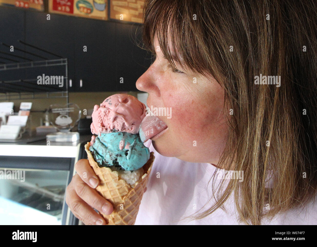 Beckie Jacobs takes a break from scooping ice cream to sample one of her favorite concoctions of