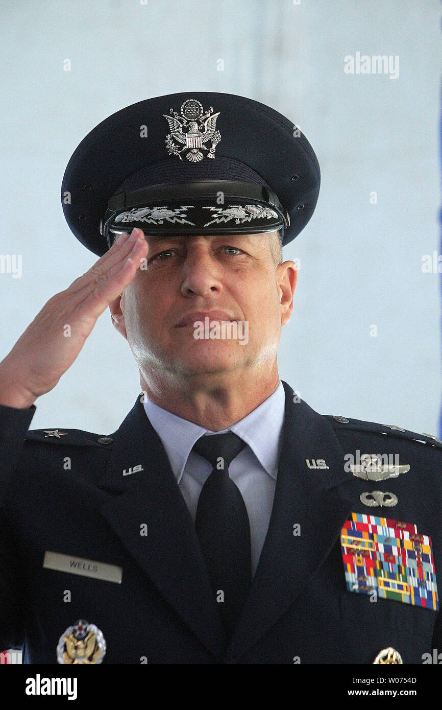 Major General Lawrence L. Wells salutes during a Silver Star ceremony for Senior Airman Bradley R. Smith in his home town of Troy, Illinois on September 8, 2012. The posthumous award is in recognition of SmithÕs heroic acts to protect other airmen following an attack in the Kandahar Province of Afghanistan on January 3, 2010. The Silver Star, the third-highest military decoration that can be awarded to any branch of the United States Military.      UPI/Bill Greenblatt Stock Photo